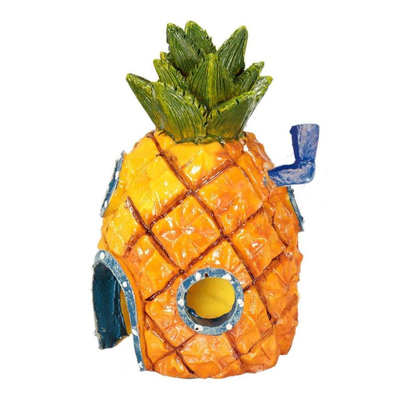 The Fish Tank Decor Pineapple House is a decorative item designed to be placed in an aquarium or fish tank. It is shaped like a pineapple and can be used as a hiding spot for fish or as a unique and fun decorative element in the tank. This item is typically made from a non-toxic, durable material, such as resin, and is safe for use in an aquatic environment. The Pineapple House can help to create a natural and interesting underwater environment for your fish, Main image